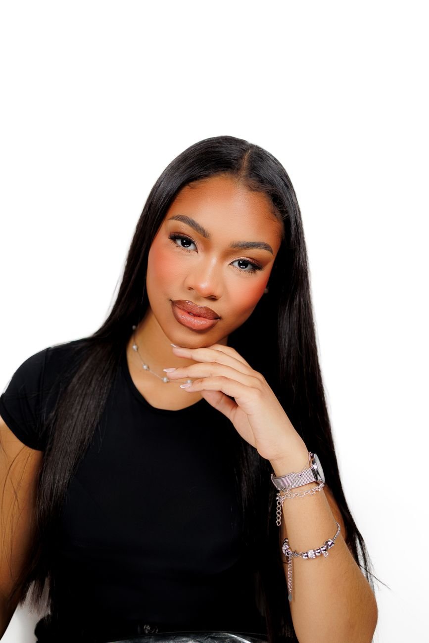 Close-up portrait of a woman with sleek long hair and elegant jewelry
